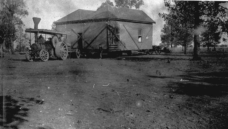 [A house being moved by steam traction engine, near Katamatite, about 1925.]
