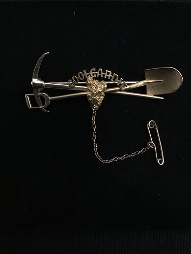 Gold miners brooch with pick and shovel motif
