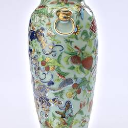 Porcelain vase with all-over pattern of birds, flowers, butterflies and two rats climbing amongst branches.