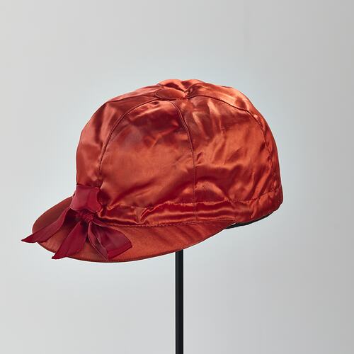 Red silk jockey cap.