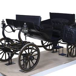 Black coach with four rubber tyres. Yellow and brown lining, and the Australian coat of arms on each door.