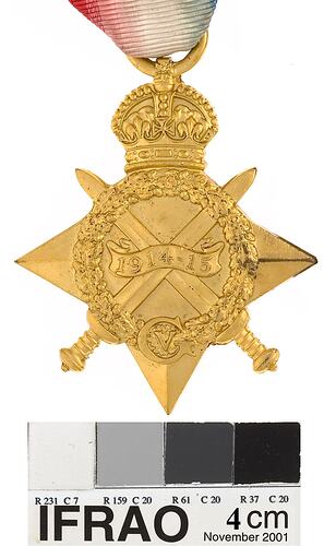 Four pointed star shaped medal with crown, crossed swords and wreath, with red, white and blue ribbon.