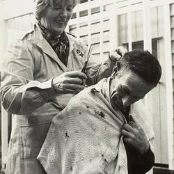 Digital Photograph - Woman Giving Man Hair Cut, Backyard, Ivanhoe, 1968