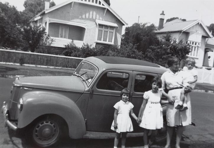 Digital Photograph - Woman with Three Girls in front of Ford 'Prefect', Glen Iris, 1961