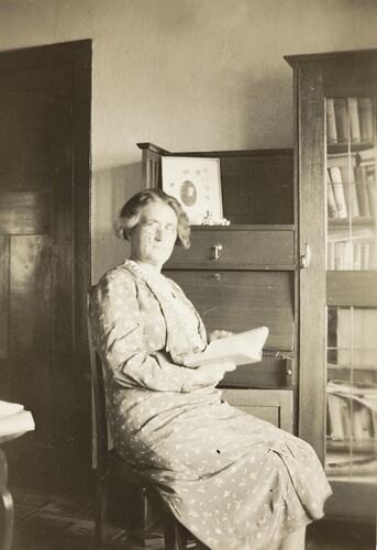 Digital Photograph - Woman Sitting at Desk in Parlour, Oakleigh, 1924