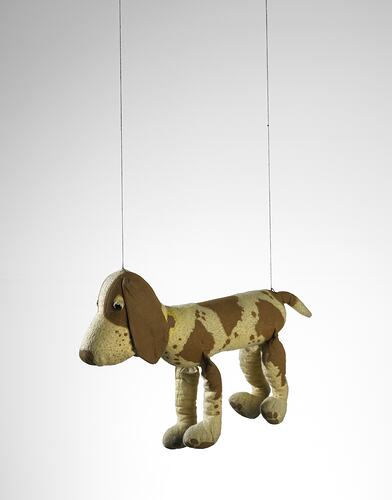 Left view of spotted dog puppet.