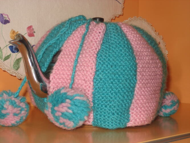 Another museum photograph of Kath Davis’s knitted tea cosy