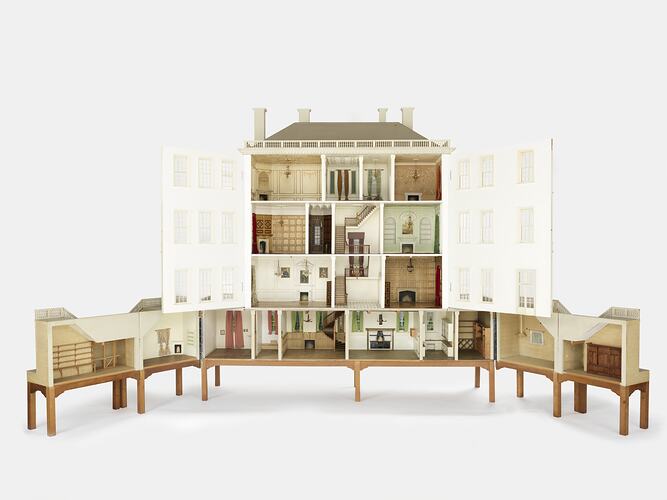 Elaborate four storey wooden doll's house. Open.