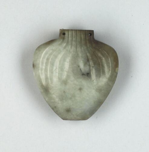 Heart shaped snuff bottle made of jade.