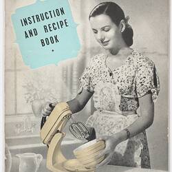 Printed booklet cover with image of woman using food mixer.