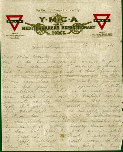 Handwritten letter in pencil on printed YMCA letterhead with two canons and two red triangle YMCA emblems.