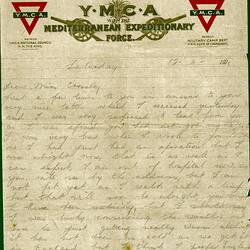 Handwritten letter in pencil on printed YMCA letterhead with two canons and two red triangle YMCA emblems.