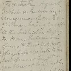 Open diary with handwritten text on discoloured worn page.