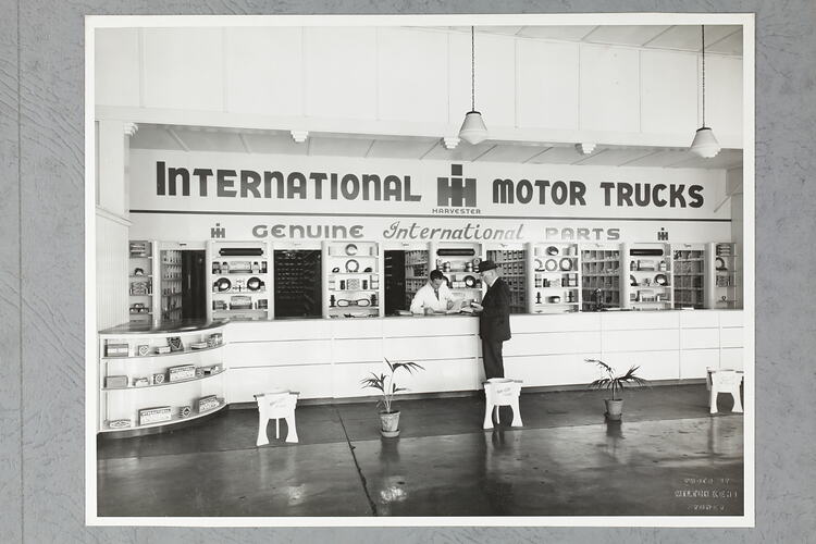 Monochrome photograph of a showroom interior.