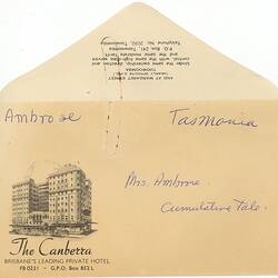 Envelope featuring handwritten notes in blue ink on paper and printed text with accompanying illustration