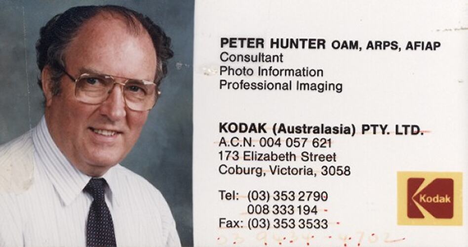 Printed business card with colour photograph of man.