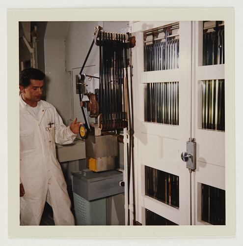 Slide 228, 'Extra Prints of Coburg Lecture', Worker at Drying & Winding Machine, Building 20, Kodak Factory, Coburg, circa 1960s