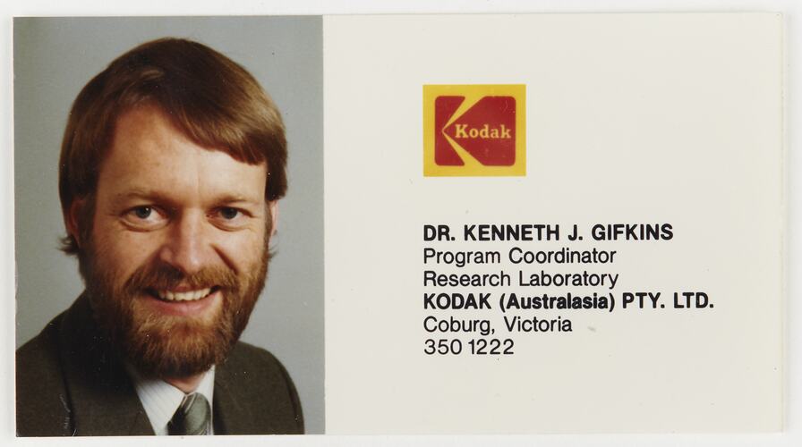 Business card with photograph of man with beard. Has Kodak logo.