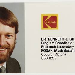 Business card with photograph of man with beard. Has Kodak logo.