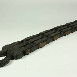 Metal chain with square links.