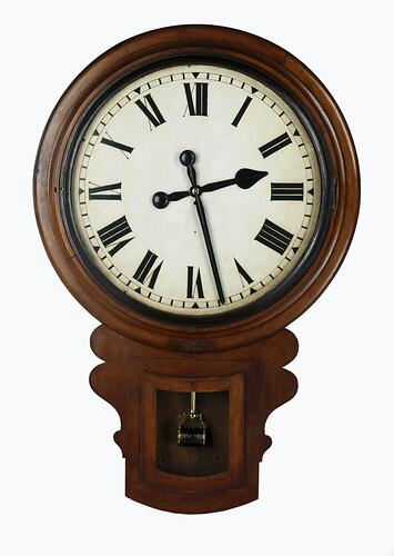 Wall clock with cedar drop dial case. Clock face is white with black Roman numerals and black painted hands.