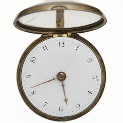 Pocket watch within gilt and tortoise shell case. White dial that has Arabic numerals.
