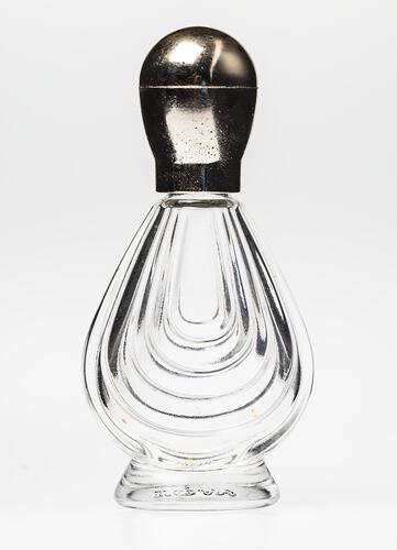 Clear glass perfume bottle, tear shaped, gold plastic lid.