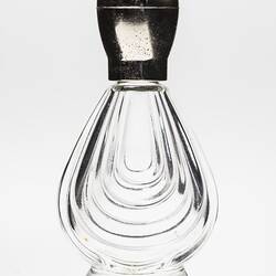Clear glass perfume bottle, tear shaped, gold plastic lid.