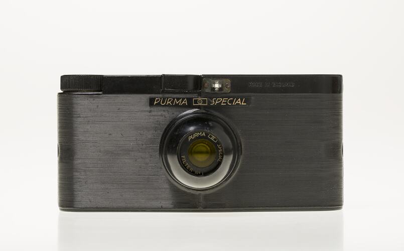 Black Bakelite camera with glass lens, plastic viewfinder and shutter.