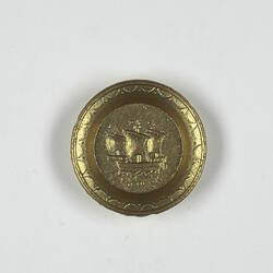 Toy round gold plate.
