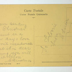 Back of printed postcard with handrwritten message.