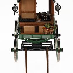 Fruiterer's four wheel van model. View from the front. Model food basket and head lamps visible.