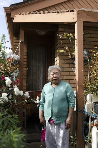 Public Housing Resident Nga [Last Name Withheld] Stands by her Doorway during the COVID-19 Pandemic, Richmond, Victoria, 7 May 2020