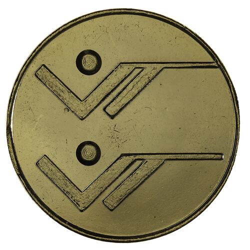Round gilt medal with shooting logo from Brisbane Commonwealth Games.