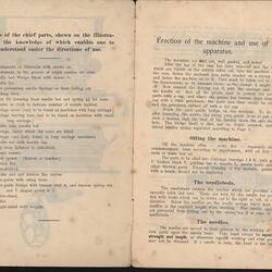 Open booklet with off-white pages and black printed text.