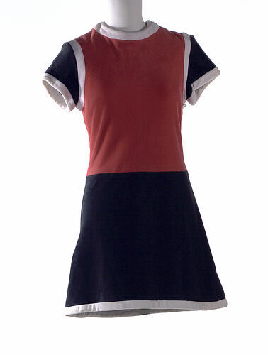 Velour mini dress, red bodice, black skirt.