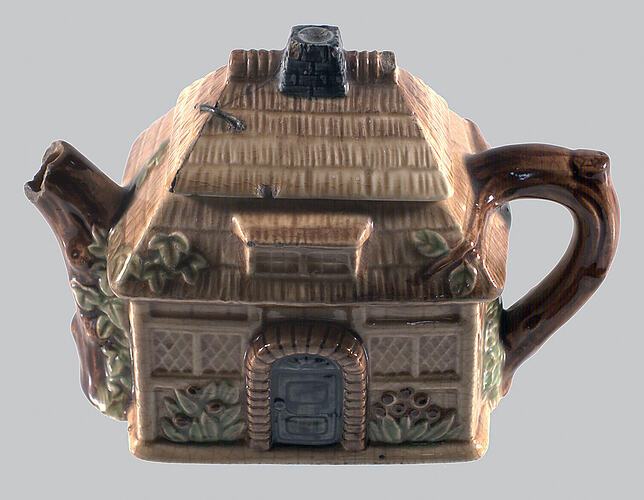 Teapot in the shape of a thatched cottage.