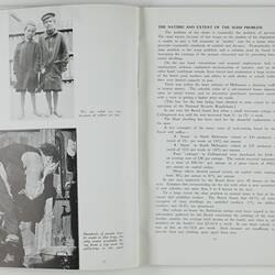 Open booklet with white pages and black printing. People on left page.