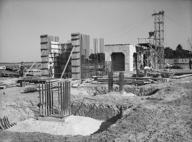 Power station construction site with concrete slabs, piers and metal reinforcement.