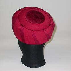 Red beret hat on a stand