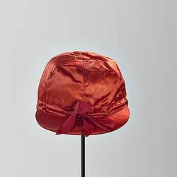 Red silk jockey cap.