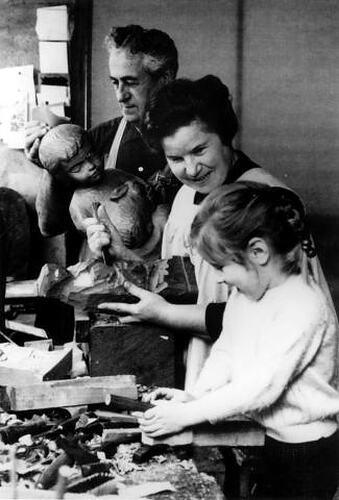 Woman and Family in working studio.