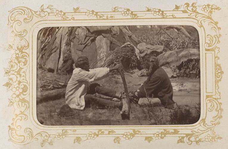 Two Victorian men demonstrating how to make fire, 1872