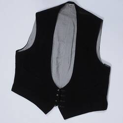 Black vest with white lining.