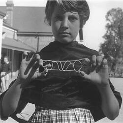 Photograph - Girl Playing 'Bridge' or 'French Lace' String Game, Dorothy Howard Tour, Australia, 1954-1955