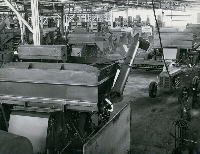 Interior view of factory assembly line, showing harvesters.