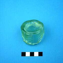 Fragment of green glass bottle base and body.