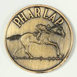 Bronze medal with race horse design.