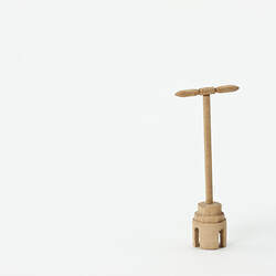 Wooden dolly for laundry.