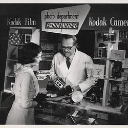 Photograph - Kodak, Man and Woman in Shop, Sydney
